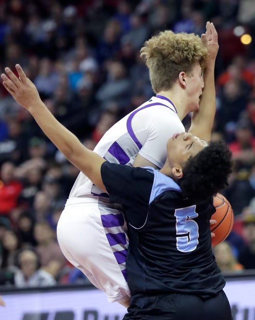 Kiel High School's Grant Manz (42) against Lakeside Lutheran High School's Kaycee Guzman (5) in a Division 3 semifinal game during the WIAA state boys basketball tournament on Thursday, March 14, 2024 at the Kohl Center in Madison, Wis.
Wm. Glasheen USA TODAY NETWORK-Wisconsin