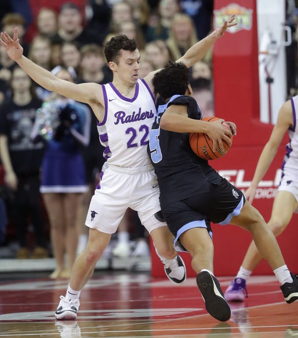 Kiel High School's Pierce Arenz (22) against Lakeside Lutheran High School's Kaycee Guzman (5) in a Division 3 semifinal game during the WIAA state boys basketball tournament on Thursday, March 14, 2024 at the Kohl Center in Madison, Wis. against Lakeside Lutheran High School defeated against Kiel High School 57-55.
Wm. Glasheen USA TODAY NETWORK-Wisconsin