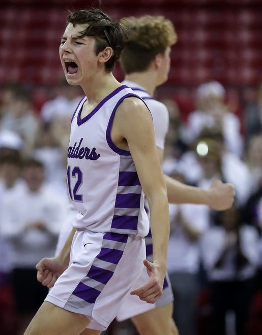Kiel High School's Aidan Murphy (12) celebrates as he heads to the bench for a timeout against Lakeside Lutheran High School in a Division 3 semifinal game during the WIAA state boys basketball tournament on Thursday, March 14, 2024 at the Kohl Center in Madison, Wis. Lakeside Lutheran won the game, 57-55.