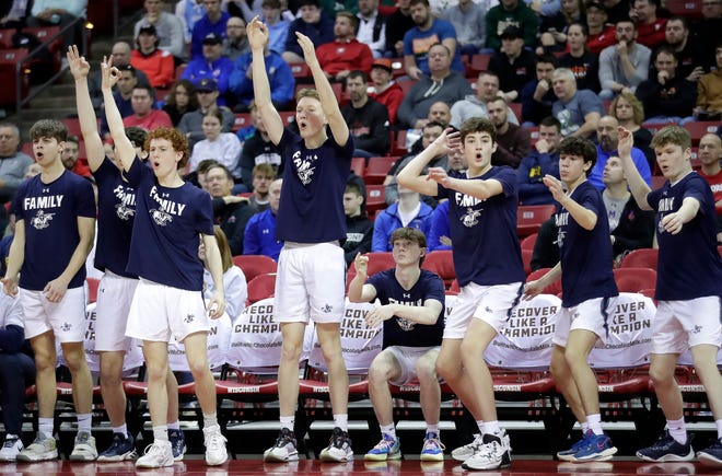 Columbus Catholic High School’s bench celebrates a 3 point shot aginst Solon Springs High School in a Division 5 semifinal game during the WIAA state boys basketball tournament on Friday, March 15, 2024 at the Kohl Center in Madison, Wis. Columbus Catholic defeated Solon 78-65.
Wm. Glasheen USA TODAY NETWORK-Wisconsin