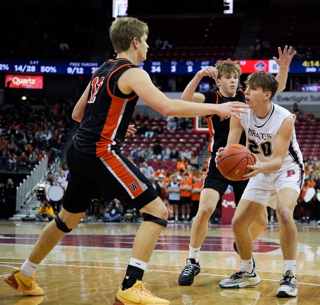 West Salem's Landon Michlig (12) and Nathan Karr (4) guard Pewaukee's Connor Haut (20) during the second half of the WIAA Division 2 boys basketball state semifinal game on Friday March 15, 2024 at the Kohl Center in Madison, Wis.
