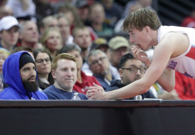 Arrowhead High School's Bennett Basich (14) checks his teeth after being struck in the mouth against Neenah High School in a Division 1 semifinal game during the WIAA state boys basketball tournament on Friday, March 15, 2024 at the Kohl Center in Madison, Wis. Arrowhead defeated Neenah for 99-95 in four overtimes.
Wm. Glasheen USA TODAY NETWORK-Wisconsin