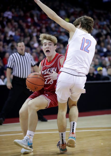 Neenah High School's Charlie Wunderlich (23) against Arrowhead High School's Sam Leoni (12) in a Division 1 semifinal game during the WIAA state boys basketball tournament on Friday, March 15, 2024 at the Kohl Center in Madison, Wis. Arrowhead defeated Neenah for 99-95 in four overtimes.
Wm. Glasheen USA TODAY NETWORK-Wisconsin
