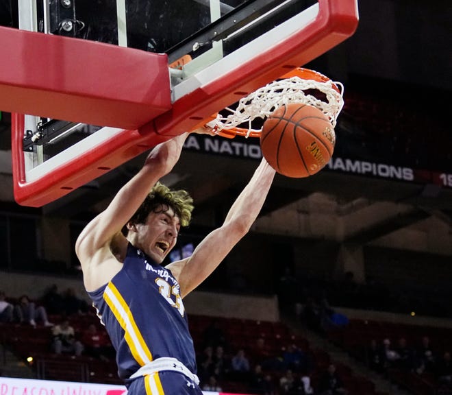 Marquette's Nolan Minessale (23) dunks during the second half of the WIAA Division 1 boys basketball state semifinal game against Kettle Moraine on Friday March 15, 2024 at the Kohl Center in Madison, Wis.