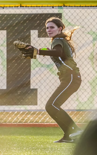 Wauwatosa West left fielder Josephine Canavan (10) readies a throw during the game at home against Wauwatosa East, Thursday, March 21, 2024.