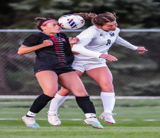 Muskego's Amanda Pankiewicz, left, and Waunakee's Claire Jaeger (9) battle for a header during the match at Muskego, Friday, April 19, 2024.